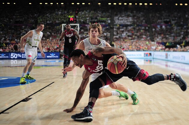 Derrick Rose of the U.S, front, vies for the ball over Slovenia's Jaka Klobucar during Basketball World Cup quarterfinal between Slovenia and United States at the Palau Sant Jordi in Barcelona, Spain, Tuesday, Sept. 9, 2014. The 2014 Basketball World Cup competition will take place in various cities in Spain from Aug. 30 through to Sept. 14. (AP Photo/Manu Fernandez)