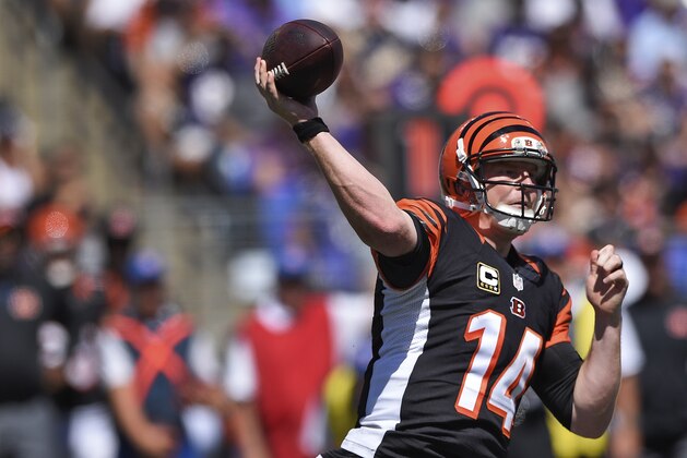 Cincinnati Bengals quarterback Andy Dalton (14) passes the ball during the first half of an NFL football game against the Baltimore Ravens in Baltimore, Md., Sunday, Sept. 7, 2014. (AP Photo/Nick Wass)