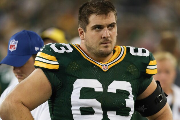 GREEN BAY, WI - AUGUST 28: Corey Linsley #63 of the Green Bay Packers looks on from the sidelines during the preseason game against the Kansas City Chiefs on August 28, 2014 at Lambeau Field in Green Bay, Wisconsin. (Photo by John Konstantaras/Getty Images)