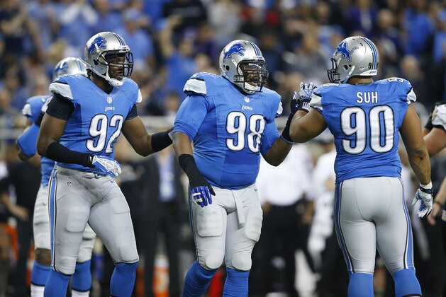 Detroit Lions defensive end Devin Taylor (92), defensive tackle Nick Fairley (98) and defensive tackle Ndamukong Suh (90) celebrate a defensive play against the Baltimore Ravens during an NFL football game at Ford Field in Detroit, Monday, Dec. 16, 2013. (AP Photo/Rick Osentoski)