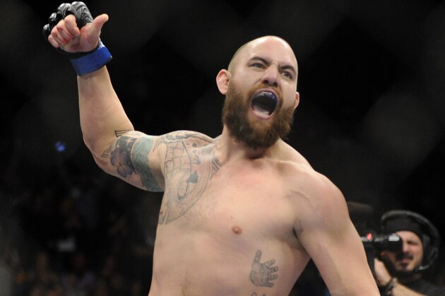 Travis Browne, of Albuquerque, N.M., reacts after defeating Josh Barnett, of Fullerton, Calif. ,during a UFC 168 mixed martial arts heavyweight bout on  Saturday, Dec. 28, 2013, in Las Vegas. Browne won by a knockout in the first round. (AP Photo/David Becker)