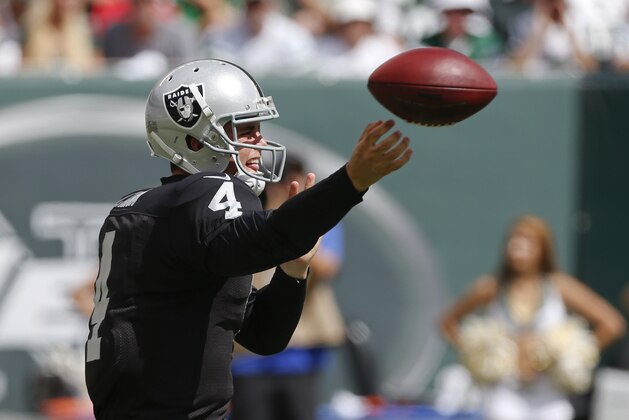 Oakland Raiders quarterback Derek Carr (4) throws a pass during the first half of an NFL football game against the New York Jets Sunday, Sept. 7, 2014, in East Rutherford, N.J. (AP Photo/Seth Wenig)