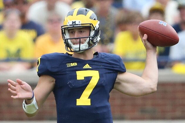 ANN ARBOR, MI - AUGUST 30:  Quarterback Shane Morris #7 of the Michigan Wolverines drops back to pass during the second half of the game against the Appalachian State Mountaineers on August 30, 2014 in Ann Arbor, Michigan. The Wolverines defeated the Mountaineers 52-14.  (Photo by Leon Halip/Getty Images)