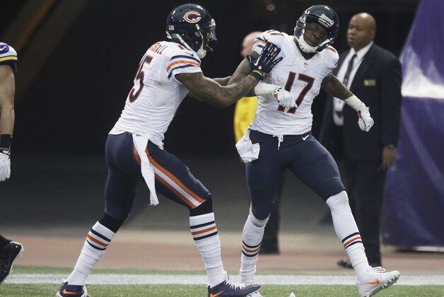 Chicago Bears wide receiver Alshon Jeffery (17) celebrates with teammate Brandon Marshall after catching a 46-yard touchdown pass during the second half of an NFL football game against the Minnesota Vikings, Sunday, Dec. 1, 2013, in Minneapolis. (AP Photo/Ann Heisenfelt)