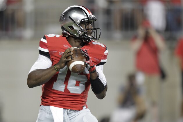 Ohio State quarterback J.T. Barrett plays against Virginia Tech during an NCAA college football game Saturday, Sept. 6, 2014, in Columbus, Ohio. (AP Photo/Jay LaPrete) Ohio State quarterback J.T. Barrett plays against Virginia Tech during an NCAA college football game Saturday, Sept. 6, 2014, in Columbus, Ohio. (AP Photo/Jay LaPrete)
