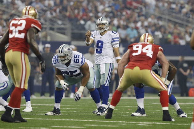 Dallas Cowboys quarterback Tony Romo (9) instructs his offense in the first half of an NFL football game against the San Francisco 49ers, Sunday, Sept. 7, 2014, in Arlington, Texas. (AP Photo/LM Otero)
