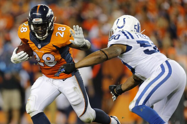 Denver Broncos running back Montee Ball (28) stiff arms Indianapolis Colts inside linebacker Jerrell Freeman (50) during the second half of an NFL football game, Sunday, Sept. 7, 2014, in Denver. (AP Photo/Joe Mahoney)