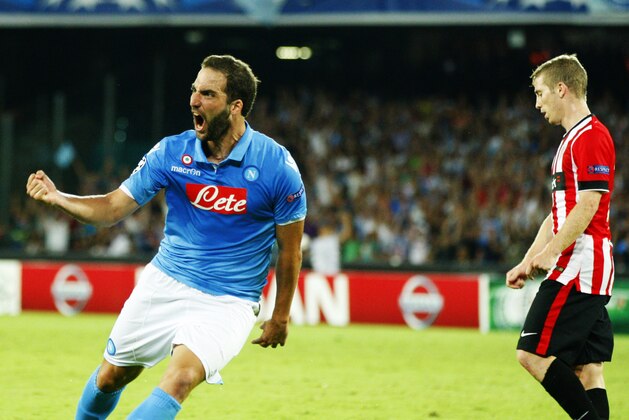 Napoli forward Gonzalo Higuaín celebrates after scoring the equalizer during the Champions League preliminary round soccer match between Napoli and Athletic Bilbao, in Naples, Italy, Tuesday, Aug. 19, 2014. (AP Photo/Salvatore Laporta)