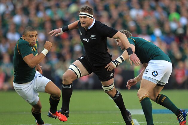File - New Zealand's Kieran Read, center, attacks as South Africa's Bryan Habana, left, and captain Jean de Villiers defend during their Rugby Championship match at Ellis Park Stadium in Johannesburg, South Africa, in this Saturday, Oct. 5, 2013 file photo. Kieran Read of New Zealand has been voted the IRB player of the year for 2013, capping a season when he became the most prolific try-scoring No. 8 in world rugby. (AP Photo/Themba Hadebe, File)