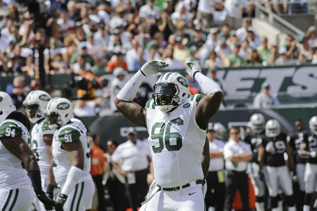 New York Jets defensive end Muhammad Wilkerson (96) gestures to the corwd during the first half of an NFL football game against the Oakland Raiders Sunday, Sept. 7, 2014, in East Rutherford, N.J. (AP Photo/Bill Kostroun)