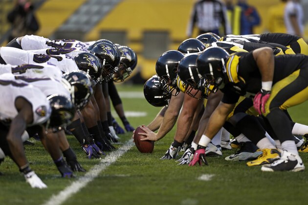 The Baltimore Ravens defensive line lines up across from the offensive line of the Pittsburgh Steelers during the third quarter of an NFL football game in Pittsburgh on Sunday, Oct. 20, 2013. The Steelers won 19-16. (AP Photo/Gene J. Puskar)