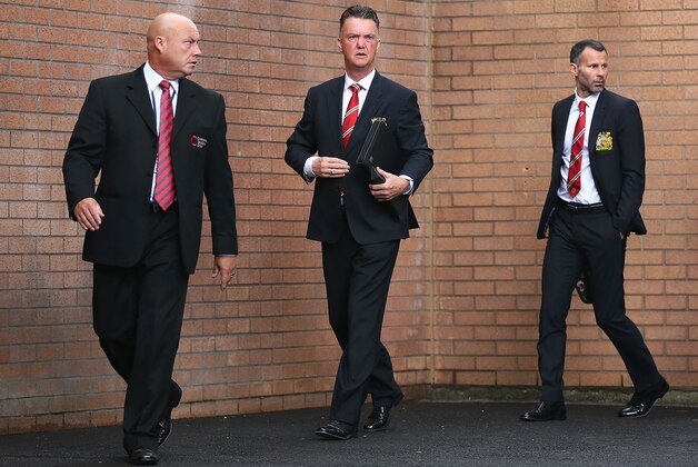BURNLEY, ENGLAND - AUGUST 30:  Manager Louis van Gaal of Manchester United (C) and assistant Ryan Giggs (R) arrive ahead of the Barclays Premier League match between Burnley and Manchester United at Turf Moor on August 30, 2014 in Burnley, England.  (Photo by Clive Brunskill/Getty Images)