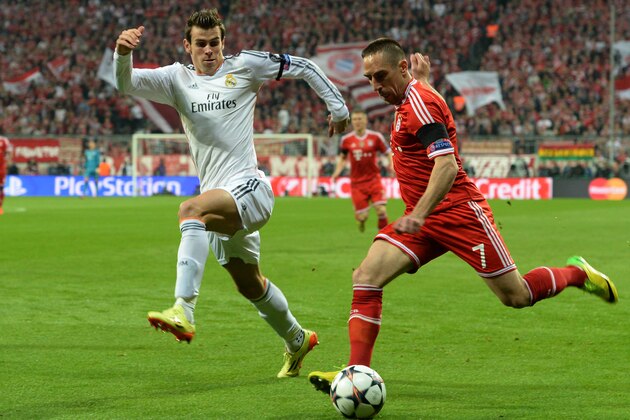 Bayern's Franck Ribery fights for the ball with Real's Gareth Bale during the Champions League semifinal second leg soccer match between Bayern Munich and Real Madrid at the Allianz Arena in Munich, southern Germany, Tuesday, April 29, 2014. (AP Photo/Kerstin Joensson)