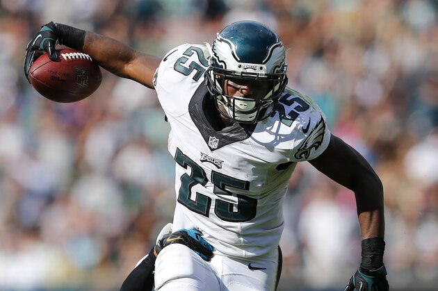 PHILADELPHIA, PA - SEPTEMBER 07:  LeSean McCoy #25 of the Philadelphia Eagles runs for a first down as Josh Evans #26 of the Jacksonville Jaguars attempts a tackle during the fourth quarter of a NFL game at Lincoln Financial Field on September 7, 2014 in Philadelphia, Pennsylvania. The Eagles defeated the Jaguars 34-17. (Photo by Rich Schultz /Getty Images)