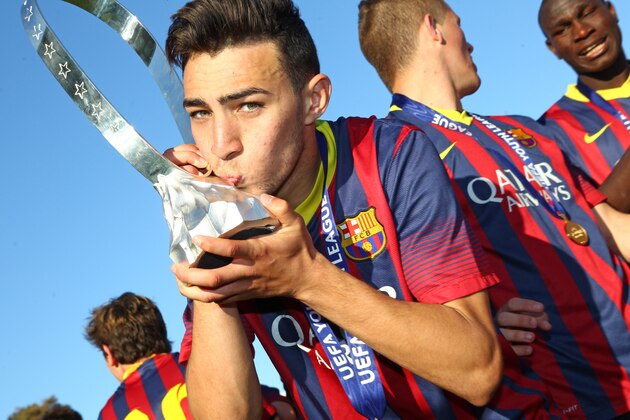 NYON, SWITZERLAND - APRIL 14: Munir El Haddadi of FC Barcelona kisses the Lennart Johansson trophy in celebration after victoy during the UEFA Youth League Final match between Benfica Lisbon and FC Barcelona at Colovray Stadion on April 14, 2014 in Nyon, Switzerland. (Photo by Philipp Schmidli/Getty Images)