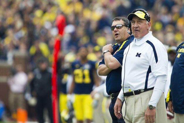 Michigan head coach Brady Hoke, left, and defensive coordinator Greg Mattison react to a replay in the third quarter of an NCAA college football game against Northwestern, Saturday, Nov. 10, 2012, in Ann Arbor, Mich. Michigan won 38-31 in overtime. (AP Photo/Tony Ding)