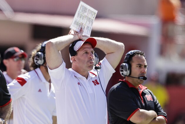 Nebraska head coach Bo Pelini holds his head while watching a replay on a big screen in the second half of an NCAA college football game against McNeese State in Lincoln, Neb., Saturday, Sept. 6, 2014. Nebraska won 31-24. (AP Photo/Nati Harnik)