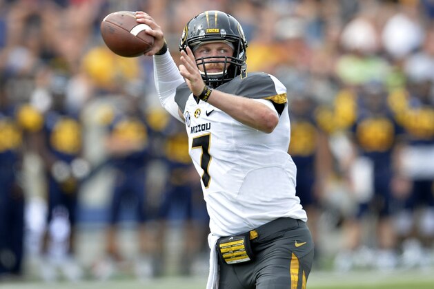 Missouri Tigers quarterback Maty Mauk (7) throws a pass in the fourth quarter of a 49-24 win over the Toledo Rockets in an NCAA college football game in Toledo, Ohio, Saturday, Sept. 6, 2014. (AP Photo/David Richard)