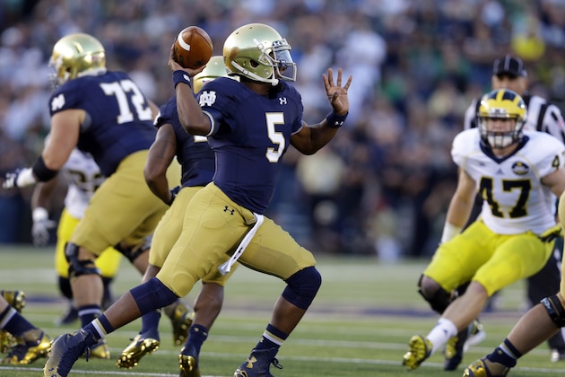 Notre Dame quarterback Everett Golson throws against Michigan during the first half of an NCAA college football game in South Bend, Ind., Saturday, Sept. 6, 2014. (AP Photo/Michael Conroy)