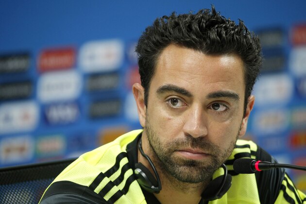 Spain's Xavi Hernandez attends a press conference the day before the group B World Cup soccer match between Spain and the Netherlands at the Arena Ponte Nova in Salvador, Brazil, Thursday, June 12, 2014.  (AP Photo/Christophe Ena)
