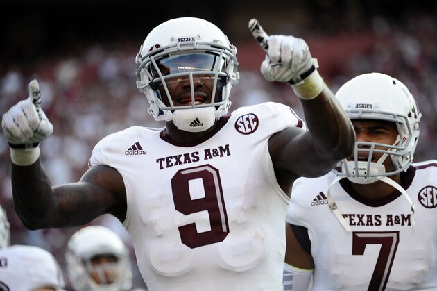 Texas A&M wide receiver Ricky Seals-Jones (9) celebrates with teammate Kenny Hill (7) after scoring a touchdown against South Carolina during the first half of an NCAA college football game on Thursday, Aug. 28, 2014, in Columbia, S.C. (AP Photo/Rainier Ehrhardt)