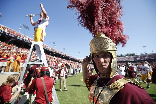 Drum Major from the Southern California's Trojan leads the band with place kicker Andre Heidari, left, after the NCAA football game against Stanford on Saturday, Sept. 6, 2014, in Stanford, Calif. (AP Photo/Tony Avelar)