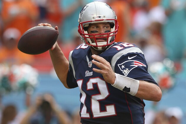 MIAMI GARDENS, FL - SEPTEMBER 07:  Tom Brady #12 of the New England Patriots throws in the second quarter against the Miami Dolphins during a game at Sun Life Stadium on September 7, 2014 in Miami Gardens, Florida.  (Photo by Mike Ehrmann/Getty Images)