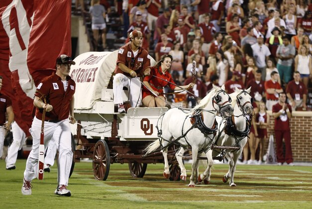 The Oklahoma Sooner Schooner is driven out onto the field following an Oklahoma touchdown against Louisiana Tech in the fourth quarter of an NCAA college football game in Norman, Okla., Saturday, Aug. 30, 2014. Oklahoma won 48-16. (AP Photo/Sue Ogrocki)