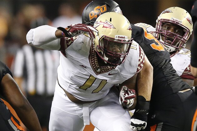 Aug 30, 2014; Arlington, TX, USA; Florida State Seminoles defensive end Derrick Mitchell Jr (11) in action against the Oklahoma State Cowboys at AT&T Stadium. The Seminoles beat the Cowboys 37-31. Mandatory Credit: Matthew Emmons-USA TODAY Sports