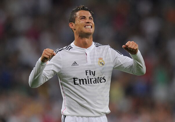 MADRID, SPAIN - AUGUST 25:  Cristiano Ronaldo of Real Madrid celebrates after scoring Real's 2nd goal during the La liga match between Real Madrid CF and Cordoba CF at Estadio Santiago Bernabeu on August 25, 2014 in Madrid, Spain.  (Photo by Denis Doyle/Getty Images)
