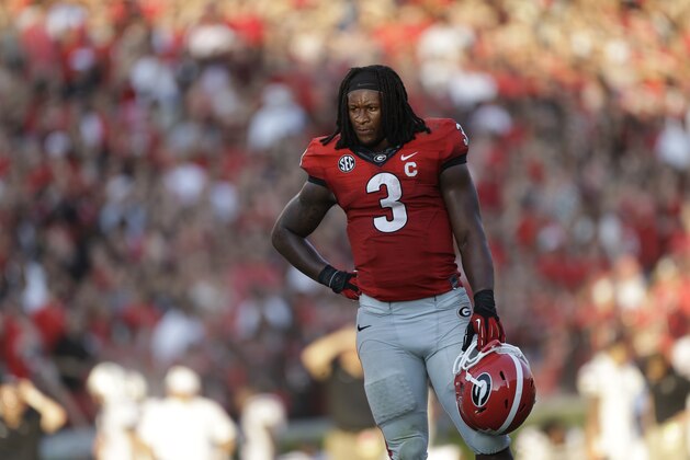 Georgia running back Todd Gurley (3) takes a break during a timeout during the second half of an NCAA football game against the South Carolina, Saturday, Sept. 7, 2013, in Athens, Ga.  (AP Photo/John Bazemore)