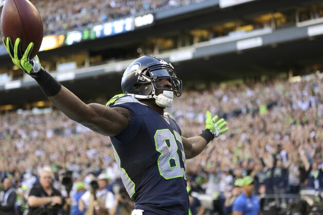Seattle Seahawks wide receiver Ricardo Lockette celebrates after his touchdown against the Green Bay Packers in the first half of an NFL football game, Thursday, Sept. 4, 2014, in Seattle. (AP Photo/Scott Eklund)