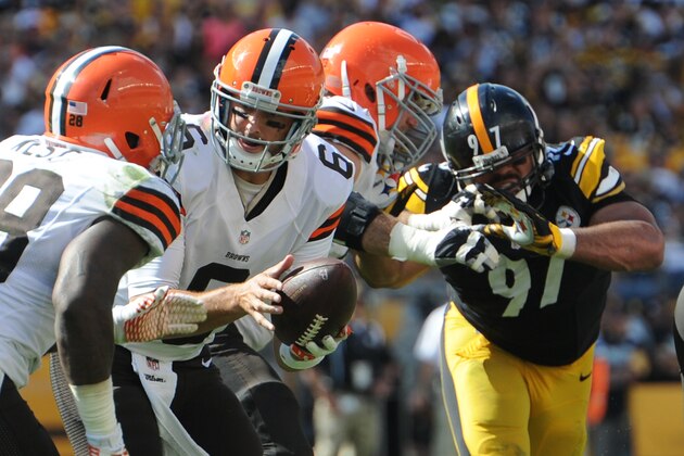 Cleveland Browns quarterback Brian Hoyer (6) hands off to running back Terrance West (28) in the NFL football game against the Pittsburgh Steelers on Sunday, Sept. 7, 2014 in Pittsburgh. (AP Photo/Don Wright)