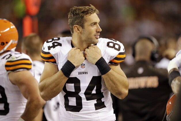 Cleveland Browns tight end Jordan Cameron watches from the bench in the second quarter of a preseason NFL football game against the Chicago Bears Thursday, Aug. 28, 2014, in Cleveland. (AP Photo/Tony Dejaj)