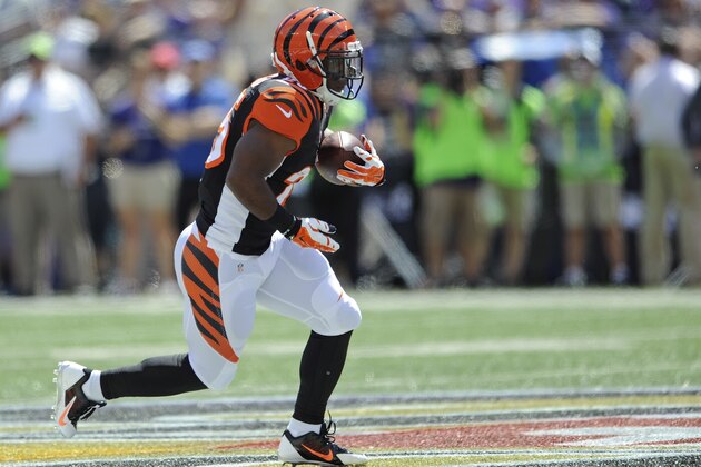 Cincinnati Bengals running back Giovani Bernard (25) carries the ball during the first half of an NFL football game against the Baltimore Ravens in Baltimore, Md., Sunday, Sept. 7, 2014. (AP Photo/Gail Burton)