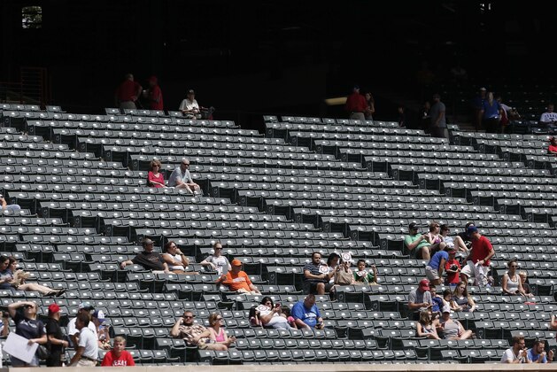 The third base side stands are nearly empty during the first inning of a baseball game between the Texas Rangers and Seattle Mariners, Sunday, Sept. 7, 2014, in Arlington, Texas. (AP Photo/Brandon Wade)