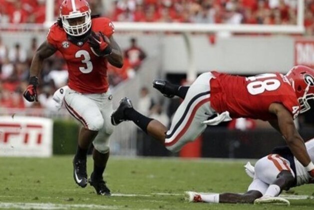 Georgia's Todd Gurley, left, runs the ball in the first half of an NCAA college football game against Clemson, Saturday, Aug. 30, 2014, in Athens, Ga. Georgia won 45-21. (AP Photo/David Goldman)