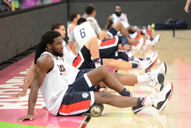 BARCELONA, SPAIN - SEPTEMBER 10: Kenneth Faried of the USA Basketball Men's National Team stretches during practice at Palau Sant Jordi on September 10, 2014 in Barcelona, Spain.  NOTE TO USER: User expressly acknowledges and agrees that, by downloading and/or using this Photograph, user is consenting to the terms and conditions of the Getty Images License Agreement. Mandatory Copyright Notice: Copyright 2014 NBAE (Photo by Garrett Ellwood/NBAE via Getty Images)