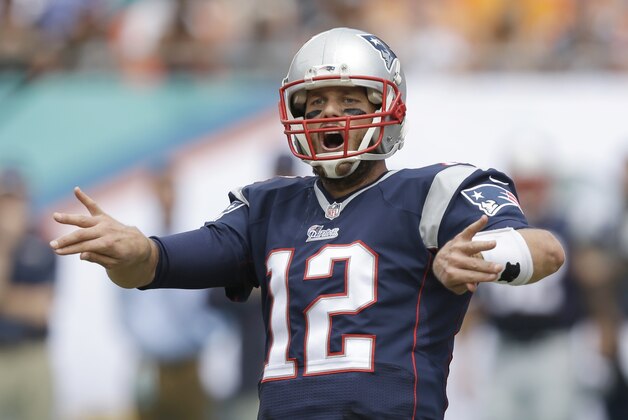 New England Patriots quarterback Tom Brady gestures during the first half of an NFL football game against the Miami Dolphins, Sunday, Sept. 7, 2014 in Miami Gardens, Fla. (AP Photo/Wilfredo Lee)
