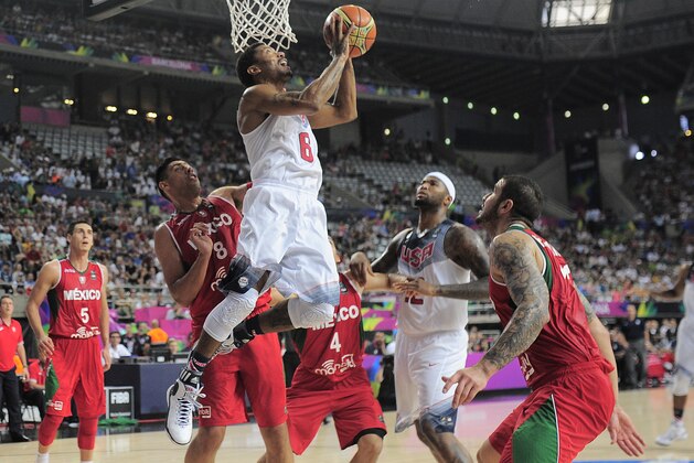 Derrick Rose of the U.S, third left, shoots over Mexico's Gustavo Ayon, second left, during Basketball World Cup Round of 16 match between United States and Mexico at the Palau Sant Jordi in Barcelona, Spain, Saturday, Sept. 6, 2014. The 2014 Basketball World Cup competition will take place in various cities in Spain from Aug. 30 through to Sept. 14. (AP Photo/Manu Fernandez)