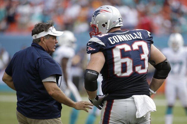 New England Patriots head coach Bill Belichick speaks to New England Patriots guard Dan Connolly (63) during the second half of an NFL football game against the Miami Dolphins, in Miami Gardens, Fla., Sunday Sept. 7, 2014. The Dolphins defeated the Patriots 33-20. (AP Photo/Lynne Sladky)