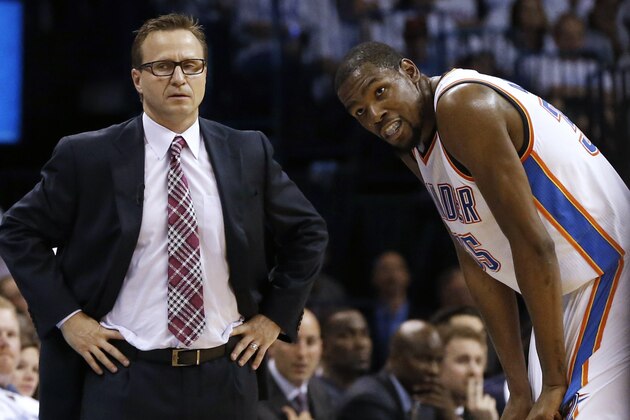 Oklahoma City Thunder coach Scott Brooks, left, and forward Kevin Durant pause during a break against the San Antonio Spurs in the second half of Game 6 of the Western Conference finals NBA basketball playoff series in Oklahoma City, Saturday, May 31, 2014. (AP Photo/Sue Ogrocki)