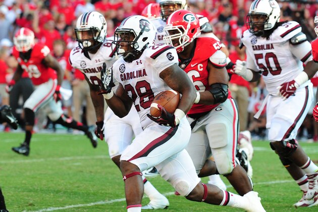ATHENS, GA - SEPTEMBER 7: Mike Davis #28 of the South Carolina Gamecocks carries the ball against the Georgia Bulldogs at Sanford Stadium on September 7, 2013 in Athens, Georgia. (Photo by Scott Cunningham/Getty Images)