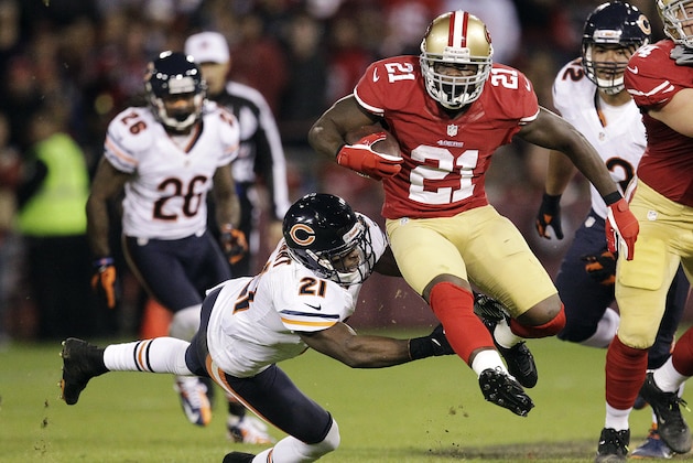 San Francisco 49ers running back Frank Gore (21) leaps past Chicago Bears strong safety Major Wright (21) during the second quarter of an NFL football game in San Francisco, Monday, Nov. 19, 2012. (AP Photo/Tony Avelar)