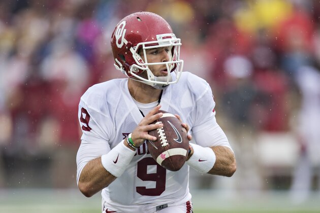 TULSA, OK - SEPTEMBER 6:  Trevor Knight #9 of the Oklahoma Sooners looks downfield for a receiver  during a game against the Tulsa Golden Hurricanes at H.A. Chapman Stadium on September 6, 2014 in Tulsa, Oklahoma.  (Photo by Wesley Hitt/Getty Images)