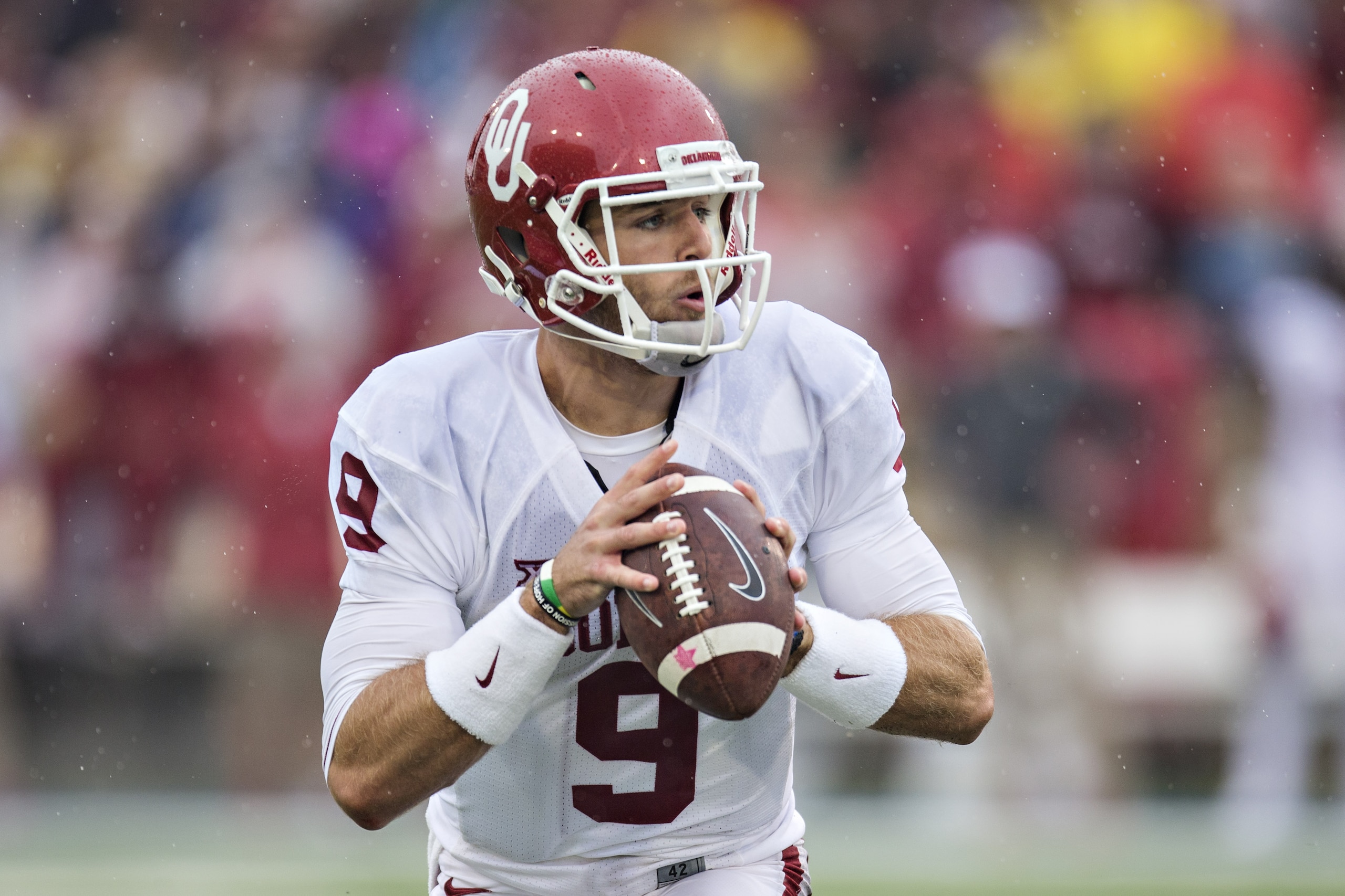 TULSA, OK - SEPTEMBER 6:  Trevor Knight #9 of the Oklahoma Sooners looks downfield for a receiver  during a game against the Tulsa Golden Hurricanes at H.A. Chapman Stadium on September 6, 2014 in Tulsa, Oklahoma.  (Photo by Wesley Hitt/Getty Images)
