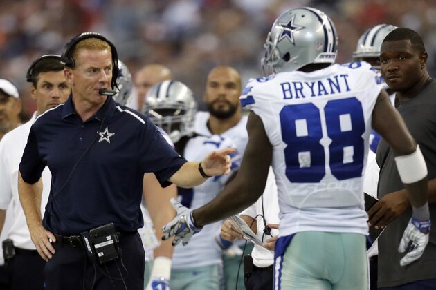 Dallas Cowboys head coach Jason Garrett, front left, talks with wide receiver Dez Bryant (88) who walks off the field during the second half of an NFL football game against the San Francisco 49ers, Sunday, Sept. 7, 2014, in Arlington, Texas. (AP Photo/Tony Gutierrez)