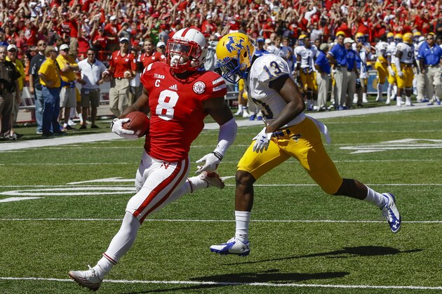 Nebraska running back Ameer Abdullah (8) runs to the end zone to score the game winning touchdown ahead of McNeese State defensive back Jermaine Antoine (13) in the second half of an NCAA college football game in Lincoln, Neb., Saturday, Sept. 6, 2014. Nebraska won 31-24. (AP Photo/Nati Harnik) Nebraska running back Ameer Abdullah (8) runs to the end zone to score the game winning touchdown ahead of McNeese State defensive back Jermaine Antoine (13) in the second half of an NCAA college football game in Lincoln, Neb., Saturday, Sept. 6, 2014. Nebraska won 31-24. (AP Photo/Nati Harnik)