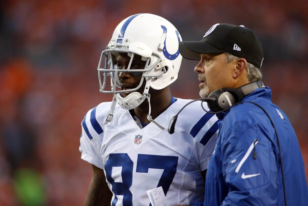 Sep 7, 2014; Denver, CO, USA;  Indianapolis Colts head coach Chuck Pagano (left) talks with wide receiver Reggie Wayne (87) during the first half against the Denver Broncos at Sports Authority Field at Mile High. Mandatory Credit: Chris Humphreys-USA TODAY Sports
