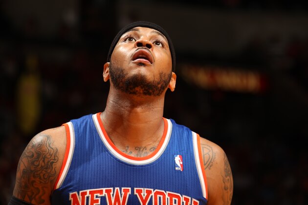 MIAMI, FL - April 6: Carmelo Anthony #7 of the New York Knicks looks on while on the court during the game at the American Airlines Arena in Miami, Florida on April 6, 2014. NOTE TO USER: User expressly acknowledges and agrees that, by downloading and/or using this photograph, user is consenting to the terms and conditions of the Getty Images License Agreement. Mandatory copyright notice: Copyright NBAE 2014 (Photo by Issac Baldizon/NBAE via Getty Images)